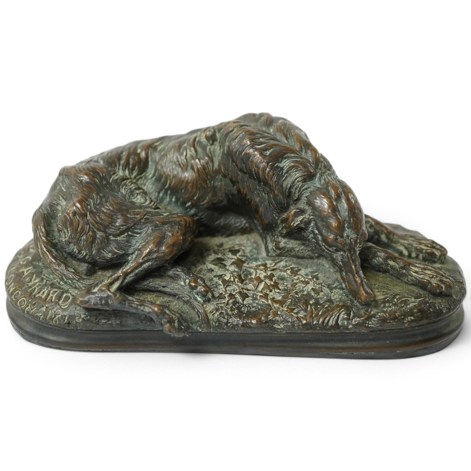 After Paul Joseph Raymond Gayrard (1807-1855), a small bronze of a deerhound in repose, 15cm wide. Condition - fair/good